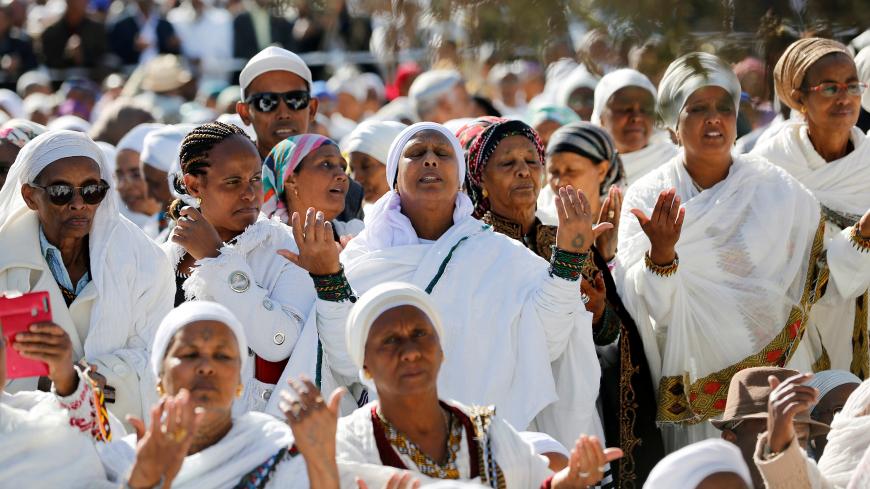 Members of the Israeli Ethiopian community pray during a ceremony marking the Ethiopian Jewish holiday of Sigd in Jerusalem November 27, 2019. REUTERS/Corinna Kern - RC2OJD9JTTLI