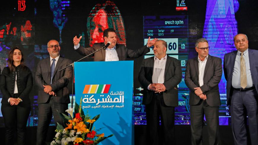 Ayman Odeh (3rd-L), leader of the Hadash party that is part of the Joint List alliance, gives an address with other alliance leaders at their electoral headquarters in Israel's northern city of Shefa-Amr on March 2, 2020, after polls officially closed. - Israeli Prime Minister Benjamin Netanyahu appeared to lead his main challenger following elections with multiple exit polls putting his right-wing Likud several seats ahead of the centrist Blue and White party. Exit polls by three Israeli television network
