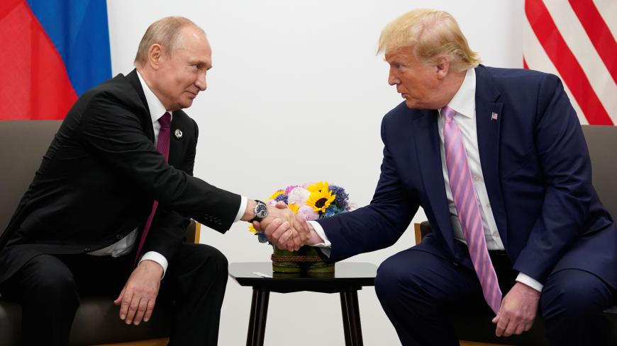 Russia's President Vladimir Putin and U.S. President Donald Trump shake hands during a bilateral meeting at the G20 leaders summit in Osaka, Japan, June 28, 2019.  REUTERS/Kevin Lamarque - RC1A050005F0