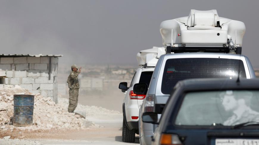 A Kurdish checkpoint is seen near Manbij, Syria October 15, 2019. REUTERS/Omar Sanadiki - RC19DD85E750