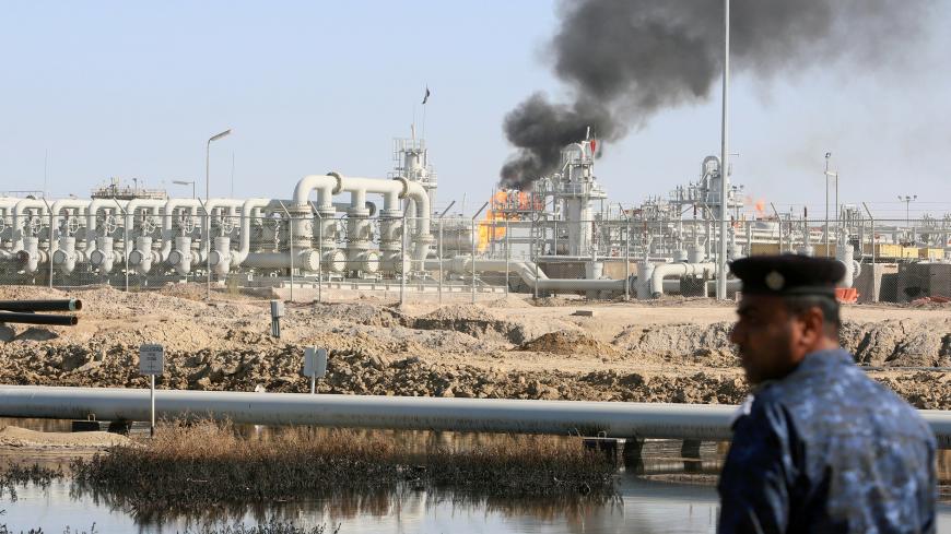 A policeman is seen at West Qurna-1 oil field, which is operated by ExxonMobil, in Basra, Iraq January 9, 2020. REUTERS/Essam al-Sudani - RC2BCE9XUK4P