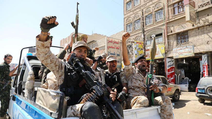 Houthi troops ride on the back of a police patrol truck after participating in a Houthi gathering in Sanaa, Yemen February 19, 2020. REUTERS/Khaled Abdullah - RC2M3F90W6HV