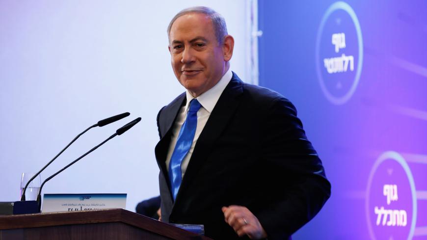 Israeli Prime Minister Benjamin Netanyahu smiles as he speaks at a regional council chairpersons' conference in Kiryat Anavim, Israel February 26, 2020. REUTERS/Ronen Zvulun - RC2A8F9CFKN0