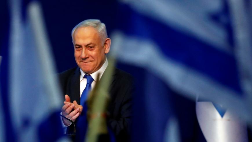 Israeli Prime Minister Benjamin Netanyahu reacts upon his arrival to address his supporters following the announcement of exit polls in Israel's election at his Likud party headquarters in Tel Aviv, Israel March 3, 2020. REUTERS/Amir Cohen - RC20CF9CV5B1
