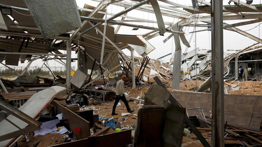 A worker checks the damages at a civilian airport under construction which, according to Iraqi religious authorities, was hit by a U.S. air strike, in the holy Shi'ite city of Kerbala, Iraq March 13, 2020. REUTERS/Alaa al-Marjani     TPX IMAGES OF THE DAY - RC2ZIF9V7W4S