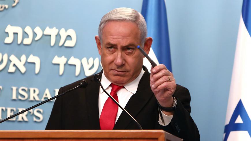 Israeli Prime Minister Benjamin Netanyahu gestures as he delivers a speech at his Jerusalem office, regarding the new measures that will be taken to fight the coronavirus, March 14, 2020. Gali Tibbon/Pool via REUTERS - RC2WJF92K7O8
