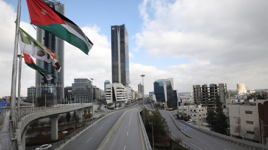 The streets of the Jordanian Capital are seen empty during the second day of a nationwide curfew, amid concerns over the spread of coronavirus disease (COVID-19), in Amman, Jordan March 22, 2020. REUTERS/Muhammad Hamed - RC24PF9QMBBD