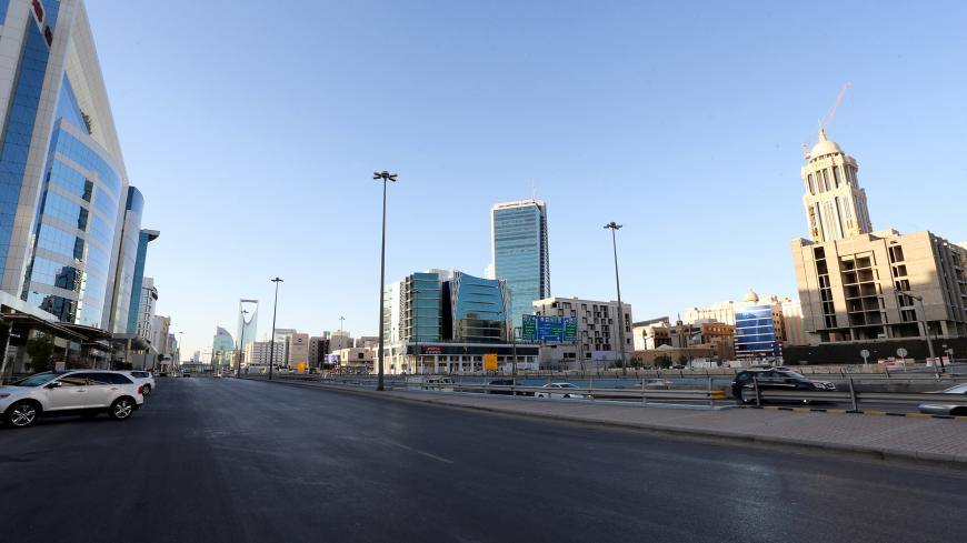 A general view shows an empty street after a curfew was imposed to prevent the spread of the coronavirus disease (COVID-19), in Riyadh, Saudi Arabia, March 23, 2020. REUTERS/Ahmed Yosri - RC2TPF91BJRT