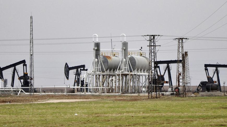 Oil pumpjacks are seen at the Rumeilan oilfield, Qamishli province December 11, 2013. Picture taken December 11, 2013.  To match Special Report SYRIA-KURDISTAN/    REUTERS/Rodi Said   (SYRIA - Tags: ENERGY POLITICS CIVIL UNREST BUSINESS COMMODITIES) - GM1EA1M1LFR01