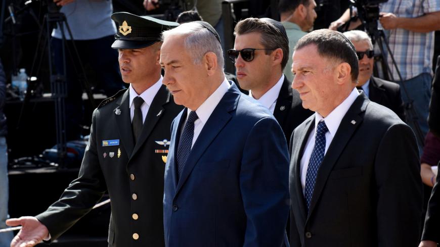 Israeli Prime Minister Benjamin Netanyahu and Israeli Knesset Speaker Yuli Edelstein arrive at a ceremony marking the annual Israeli Holocaust Remembrance Day at the Yad Vashem World Holocaust Remembrance Center in Jerusalem, April 12, 2018. Debbie Hill/Pool via Reuters - RC14F3B0A970