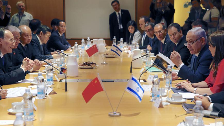Israeli Prime Minister Benjamin Netanyahu (2 R) talks during a meeting with Chinese Vice President Wang Qishan (L) in Jerusalem, on October 24, 2018. - Chinese Vice President Wang Qishan on Monday became the most senior Beijing official to visit Israel in 18 years, as the two countries look to bolster their growing business ties. (Photo by Ariel Schalit / POOL / AFP)        (Photo credit should read ARIEL SCHALIT/AFP via Getty Images)