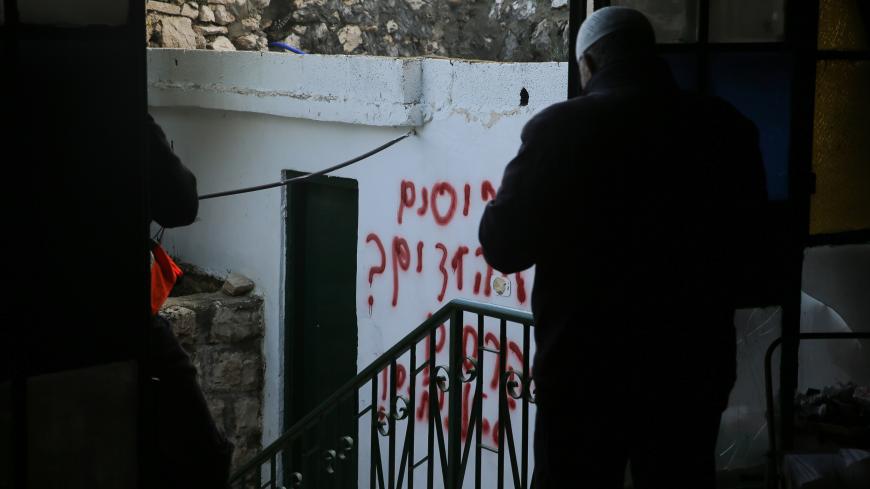 JERUSALEM - JANUARY 24 : A view of Hebrew racial slurs on the wall of the mosque sprayed by Jewish settlers as eyewitnesses reported that a group of settlers set fire to the Badriya mosque in Beit Safafa town in Jerusalem on January 24, 2020. (Photo by Mostafa Alkharouf/Anadolu Agency via Getty Images)
