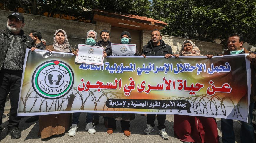 GAZA CITY, GAZA - MARCH 19: Palestinians gather for a demonstration to demand coronavirus (COVID-19) protection for Palestinian prisoners held in Israeli jails, in Gaza City, Gaza on March 19, 2020. (Photo by Ali Jadallah/Anadolu Agency via Getty Images)