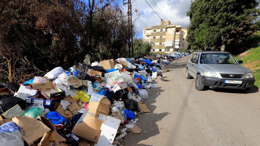 BEIRUT, LEBANON - JULY 25: Before and after photos of Lebanese garbage crisis show rubbish bags piled up on the side of the road  and the road after the garbages removed, in Hazmiyah, east of Beirut, Lebanon on July 25, 2017.

 (Photo by Ratib Al Safadi/Anadolu Agency/Getty Images)