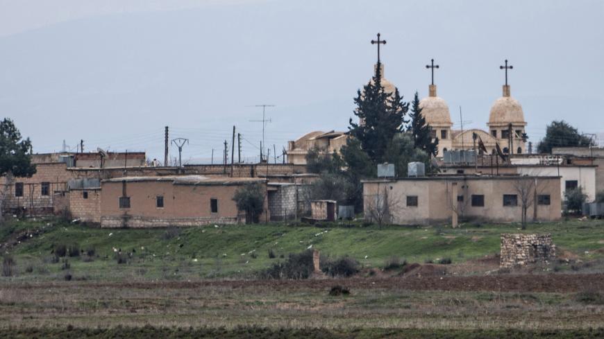 A general view shows a church in the Assyrian village of Abu Tina, which was recently captured by Islamic State fighters, February 25, 2015. Kurdish militia pressed an offensive against Islamic State in northeast Syria on Wednesday, cutting one of its supply lines from Iraq, as fears mounted for dozens of Christians abducted by the hardline group. The Assyrian Christians were taken from villages near the town of Tel Tamr, some 20 km (12 miles) to the northwest of the city of Hasaka. There has been no word o