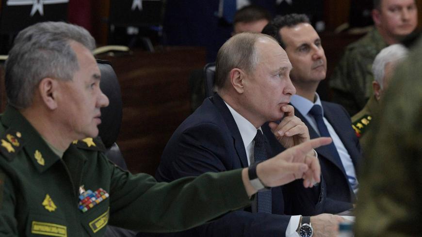 Russian President Vladimir Putin, Defence Minister Sergei Shoigu and Syrian President Bashar al-Assad attend a meeting in Damascus, Syria January 7, 2020. Sputnik/Alexei Druzhinin/Kremlin via REUTERS  ATTENTION EDITORS - THIS IMAGE WAS PROVIDED BY A THIRD PARTY. - RC29BE9XR6LF
