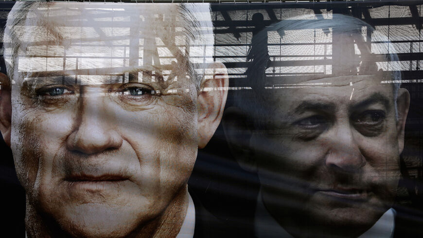 A banner depicts Benny Gantz, leader of Blue and White party, and Israel Prime minister Benjamin Netanyahu, as part of Blue and White party's campaign ahead of the upcoming election, in Tel Aviv, Israel February 17, 2020. REUTERS/Ammar Awad     TPX IMAGES OF THE DAY - RC2D2F9AUSHJ