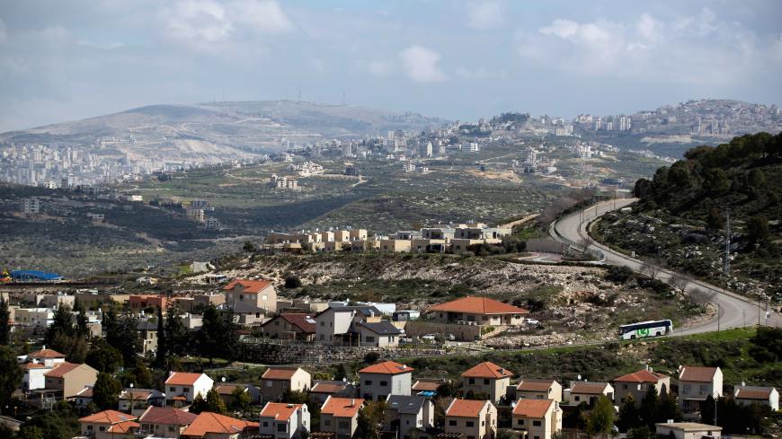 Houses in the Israeli settlement of settlement of Kedumim are seen in the foreground as part of the Palestinian city of Nablus is seen in the background (far left) in the Israeli-occupied West Bank February 20, 2020. Picture taken February 20, 2020. REUTERS/Ronen Zvulun - RC2R7F9HN66O