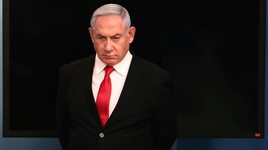 Israeli Prime Minister Benjamin Netanyahu arrives for a speech at his Jerusalem office, regarding the new measures that will be taken to fight the coronavirus, March 14, 2020. Gali Tibbon/Pool via REUTERS - RC2WJF9BHL7Z