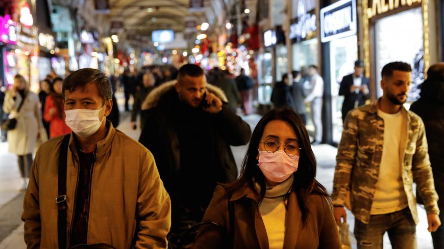 People wear protective face masks due to coronavirus concerns in Istanbul, Turkey March 16, 2020. REUTERS/Umit Bektas - RC27LF997IWS