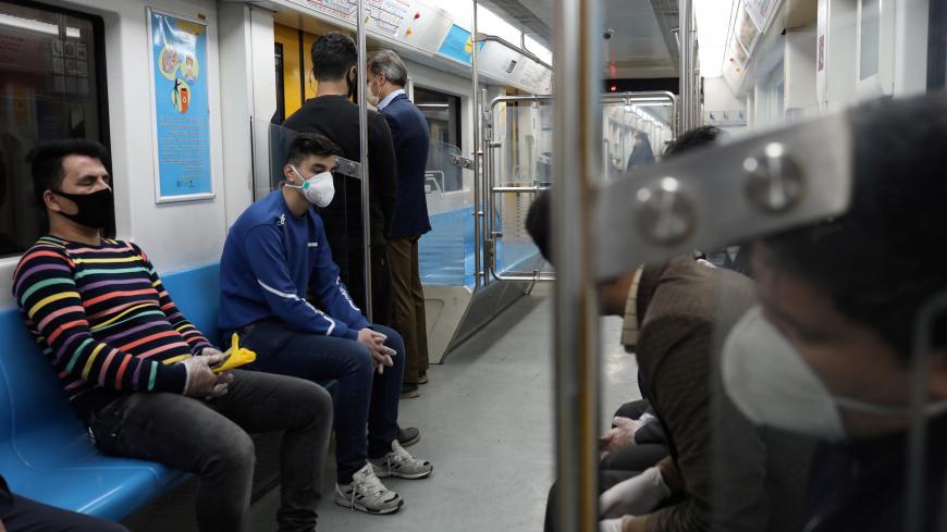 People wear protective face masks, following the outbreak of coronavirus, as they sit in a metro in Tehran, Iran March 17, 2020. WANA (West Asia News Agency)/Ali Khara via REUTERS ATTENTION EDITORS - THIS PICTURE WAS PROVIDED BY A THIRD PARTY - RC2PLF9NILL2