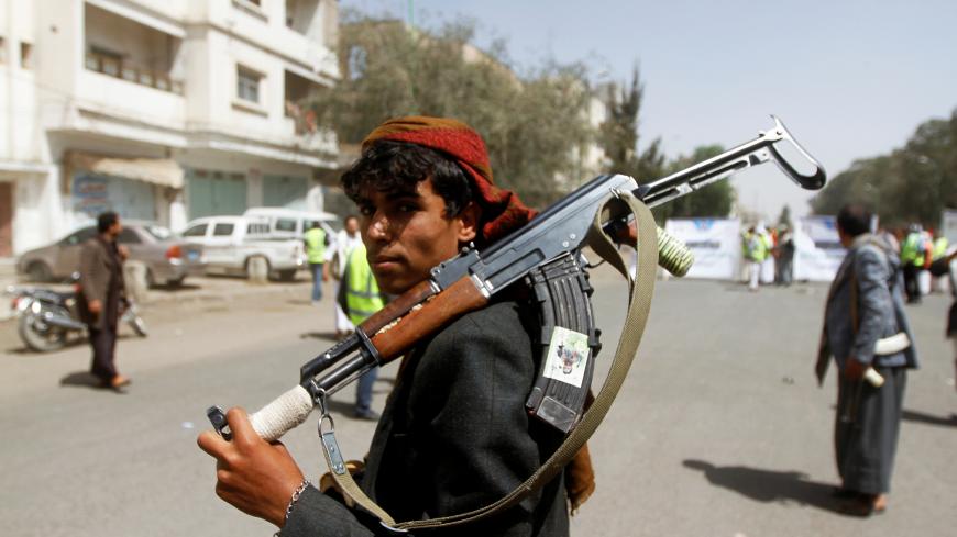 A Houthi supporter looks on as he carries a weapon during a gathering in Sanaa, Yemen April 2, 2020. REUTERS/Mohamed al-Sayaghi - RC2CWF9RBYKA