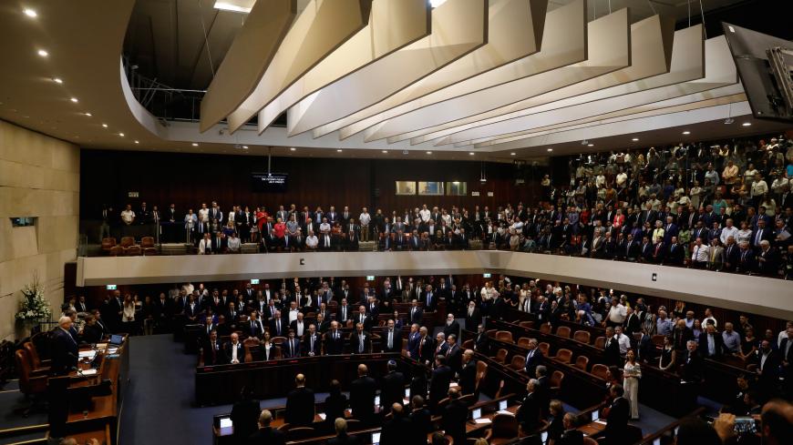 Members of the 22nd Knesset, the Israeli parliament, stand during their swearing-in ceremony, in Jerusalem October 3, 2019. REUTERS/Ronen Zvulun - RC1172B0B270