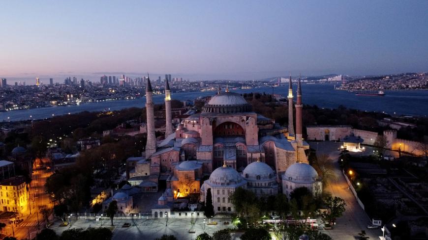An aerial view of the Byzantine-era monument of Hagia Sophia on the first day of the holy month of Ramadan, during a four-day curfew which was imposed to prevent the spread of the coronavirus disease (COVID-19), in Istanbul, Turkey, April 24, 2020. Picture taken with a drone. REUTERS/Umit Bektas - RC27BG9RQF95