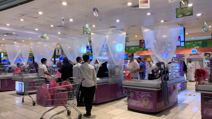 People shop at a supermarket after the Saudi government eased a curfew and allowed stores to open, following the outbreak of coronavirus disease (COVID-19), in Riyadh, Saudi Arabia April 29, 2020. REUTERS/Marwa Rashad - RC2CEG9U1YOY