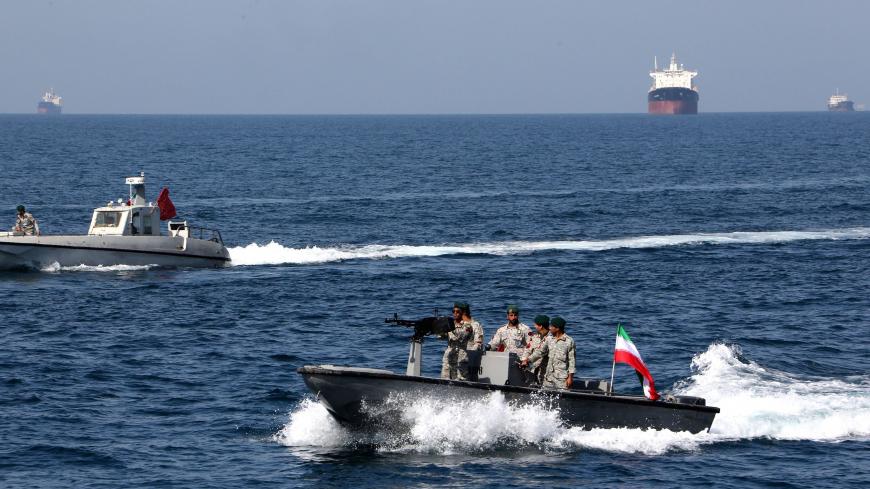 Iranian soldiers take part in the "National Persian Gulf day"  in the Strait of Hormuz, on April 30, 2019. - The date coincides with the anniversary of a successful military campaign by Shah Abbas the Great of Persia in the 17th century, which drove the Portuguese navy out of the Hormuz Island, after which is named the waterway which separates the Gulf from the Sea of Oman. (Photo by ATTA KENARE / AFP)        (Photo credit should read ATTA KENARE/AFP via Getty Images)