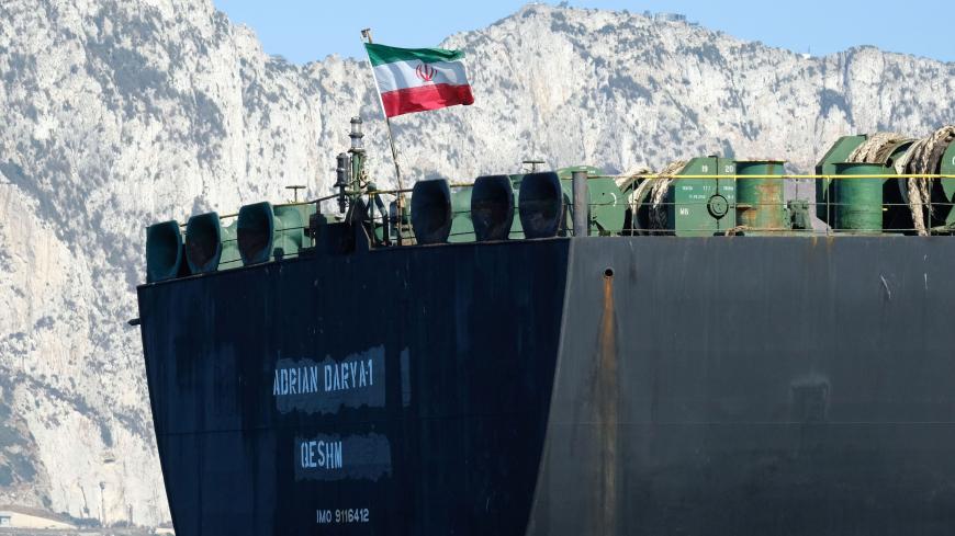 An Iranian flag flutters on board the Adrian Darya oil tanker, formerly known as Grace 1, off the coast of Gibraltar on August 18, 2019. - Gibraltar rejected a US demand to seize the Iranian oil tanker at the centre of a diplomatic dispute as it prepared to leave the British overseas territory after weeks of detention. (Photo by Johnny BUGEJA / AFP) (Photo by JOHNNY BUGEJA/AFP via Getty Images)