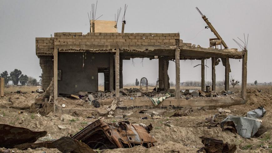 The house of local farmer Hamad al-Ibrahim is seen destroyed in the eastern Syrian village of Baghouz on March 13, 2020, a year after the fall of the Islamic State's (IS) caliphate. - A year after the last black flag of the Islamic State group was lowered in the Syrian village of Baghouz, traces of the jihadist group are still all around this small and remote village near the Iraqi border, where Kurdish fighters and the US-led coalition declared the IS proto-state defeated in March 2019 after a blistering m