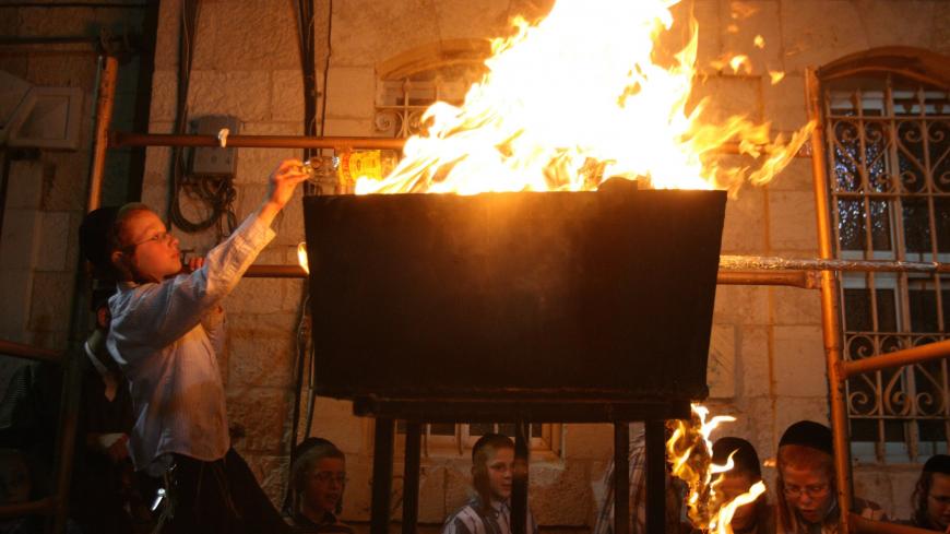 JERUSALEM, ISRAEL - MAY 15: (ISRAEL OUT) Ultra-Orthodox Jews celebrate the festival of Lag b'Omer, the 33rd day of the Omer, May 15, 2006 in their religious neighborhood of Mea Shearim in Jerusalem, Israel. Lag b'Omer, the one day of celebration that breaks a 50-day semi-mourning period of the Omer between the festivals of Pesach (Passover) and Shavuot, is marked by singing and dancing around joyous bonfires. (Photo by Uriel Sinai/Getty Images)