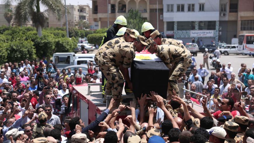 Egyptian soldiers carry the coffin of a soldier, who was killed a day earlier in the restive Sinai Peninsula in an attack by the Islamic State group, during a funeral ceremony in the 10th of Ramadan city, about 60 kms north of Cairo, on July 8, 2017.

The attack was one the deadliest against the military in a jihadist insurgency that has killed hundreds of policemen and soldiers in the past four years. The jihadists attacked several checkpoints with car bombs and heavy gunfire in a coordinated assault, for 