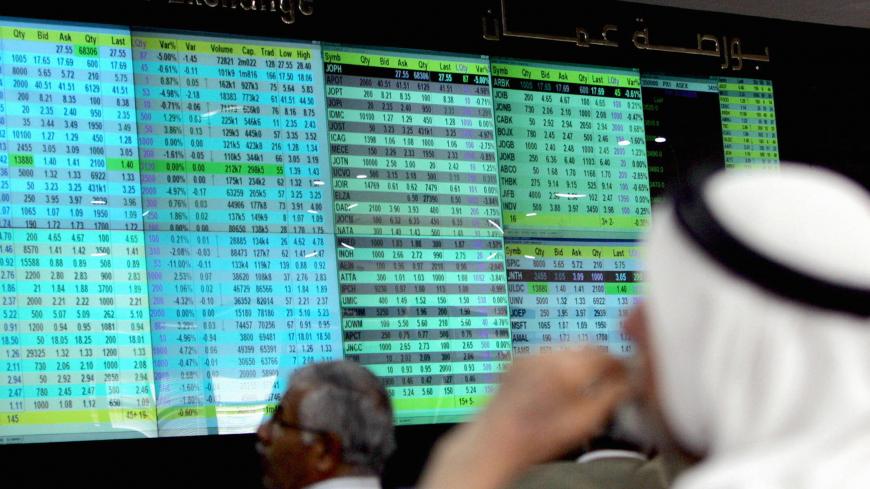 Jordanian traders follow the market's movements at the Amman Stock Exchange on October 21, 2008. Jordan's King Abdullah II announced earlier this month a series of economic measures for his cash-strapped desert kingdom, where inflation and unemployment are both hovering around 15 percent. AFP PHOTO/KHALIL MAZRAAWI (Photo credit should read KHALIL MAZRAAWI/AFP via Getty Images)