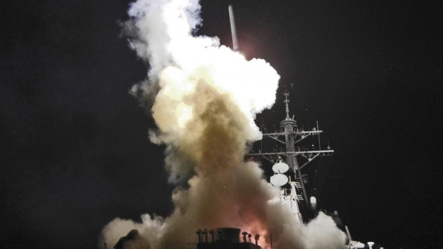 Arleigh Burke-class guided-missile destroyer USS Barry (DDG 52) launches a Tomahawk missile in support of Operation Odyssey Dawn in the Mediterranean Sea in this handout photo March 19, 2011. This was one of approximately 110 cruise missiles fired from U.S. and British ships and submarines that targeted about 20 radar and anti-aircraft sites along Libya's Mediterranean coast. Joint Task Force Odyssey Dawn is the U.S. Africa Command task force established to provide operational and tactical command and contr