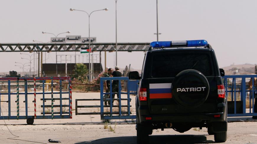 Russian and Syrian forces are seen in the Nasib border crossing with Jordan in Deraa, Syria July 7, 2018.REUTERS/ Omar Sanadiki - RC1BD48D1A50