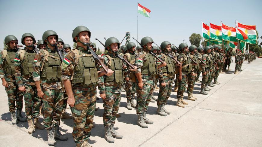 Kurdish Peshmerga Forces take part in their graduation ceremony at a military camp in Erbil, Iraq, August 21, 2019.  REUTERS/Azad Lashkari - RC1EEC7735A0