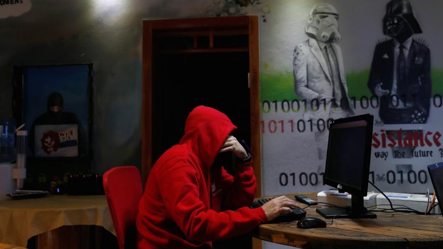 A man takes part in a training session at Cybergym, a cyber-warfare training facility backed by the Israel Electric Corporation, at their training center in Hadera, Israel  July 8, 2019. REUTERS/Ronen Zvulun - RC1118AE8A50
