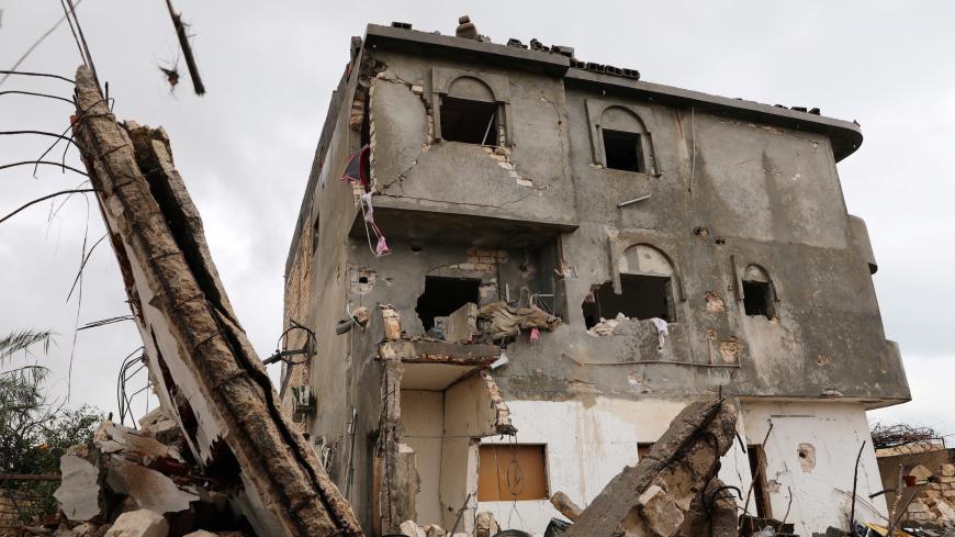 A damaged building is seen after an air strike at Tajura neighbourhood, east of Tripoli, Libya December 30, 2019.  REUTERS/Ismail Zitouny - RC2M5E9SRY8O