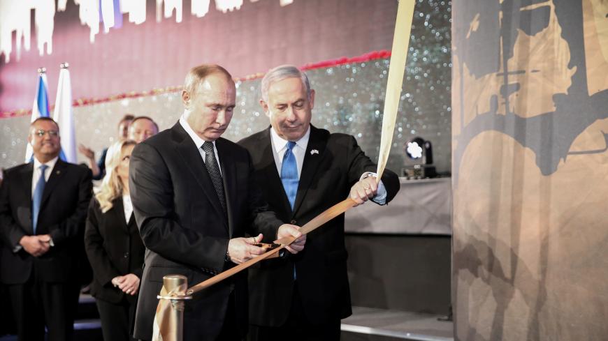 Russian President Vladimir Putin and Israeli Prime Minister Benjamin Netanyahu inaugurate a monument dedicated to the victims of Leningrad Siege during the Second World War, in Jerusalem, January 23, 2020. Amit Shabi/Pool via REUTERS - RC2OLE9I7X3F