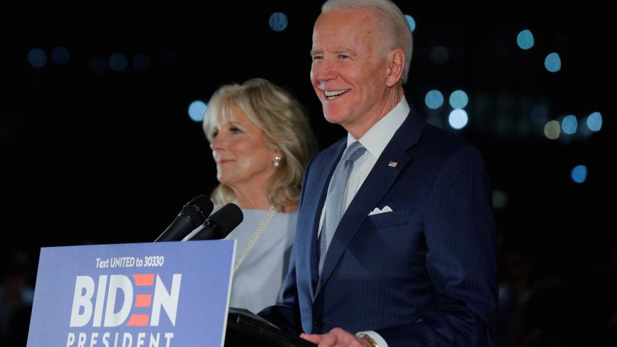 Democratic U.S. presidential candidate and former Vice President Joe Biden smiles as he speaks with his wife Jill at his side during a primary night news conference at The National Constitution Center in Philadelphia, Pennsylvania, U.S., March 10, 2020. REUTERS/Brendan McDermid - RC2EHF9E1P51