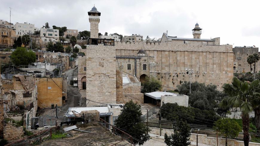 The Muslim Ibrahimi Mosque, adjoining the Jewish Tomb of the Patriarchs, is seen closed during Friday prayer over concerns of the spread of the coronavirus disease, in Hebron in the Israeli-occupied West Bank March 20, 2020. REUTERS/Mussa Qawasma - RC2ONF9J9POW