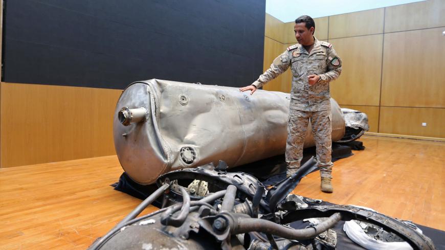 Saudi-led coalition spokesman, Colonel Turki al-Malki, displays the debris of a ballistic missile which he says was launched by Yemen's Houthi group towards the capital Riyadh, during a news conference in Riyadh, Saudi Arabia March 29, 2020. REUTERS/Ahmed Yosri - RC2VTF9ERLB8