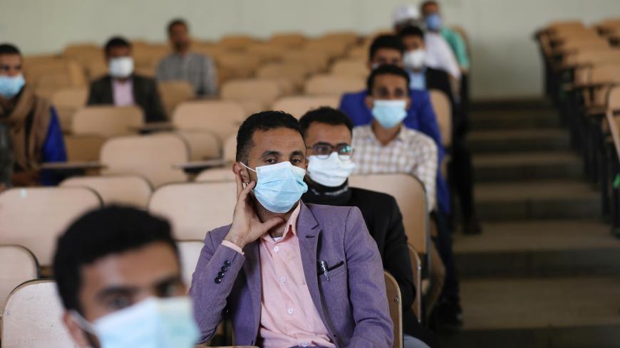 Volunteers for a coronavirus awareness campaign wearing protective face masks attend lecture in preparation for any possible spread of the coronavirus disease (COVID-19), in Sanaa, Yemen March 28, 2020. Picture taken March 28, 2020. REUTERS/Khaled Abdullah - RC2XUF93UGU1