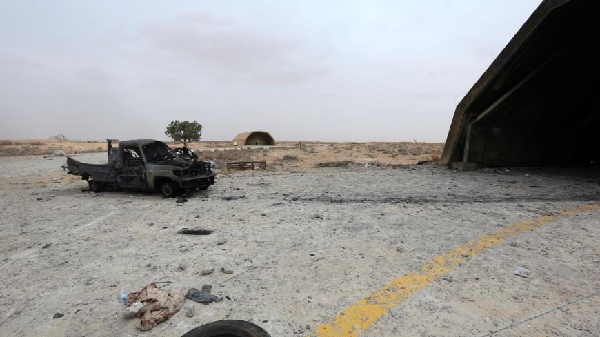 A damaged  military vehicle is seen after fighters loyal to Libya's internationally recognised government took control of Watiya airbase, southwest of Tripoli, Libya May 18, 2020. REUTERS/Hazem Ahmed - RC25RG9IM08T