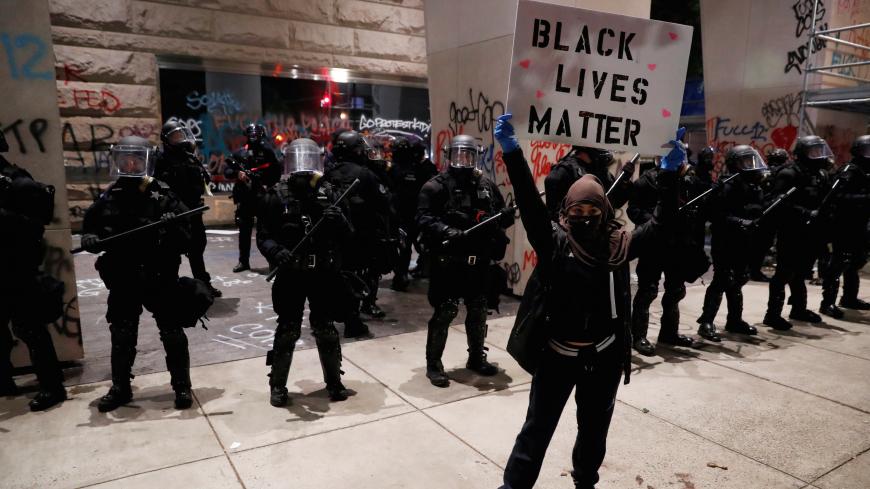 Protesters rally against the death in Minneapolis police custody of George Floyd, in Portland, Oregon, U.S. May 31, 2020. Picture taken May 31, 2020. REUTERS/Terray Sylvester - RC290H9GACGT