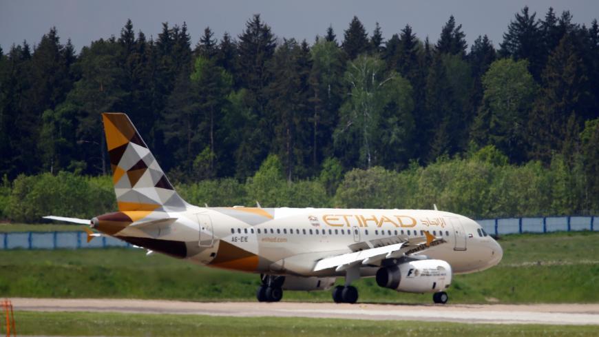 A plane of Etihad Airways company is seen at Minsk international airport near the village of Slabada, Belarus, May 19, 2016.  REUTERS/Vasily Fedosenko - D1AETKFQNAAC