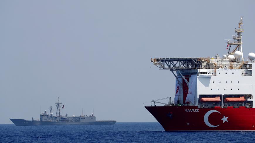 Turkish drilling vessel Yavuz is escorted by Turkish Navy frigate TCG Gemlik (F-492) in the eastern Mediterranean Sea off Cyprus, August 6, 2019. Picture taken August 6, 2019. REUTERS/Murad Sezer - RC110E733AB0