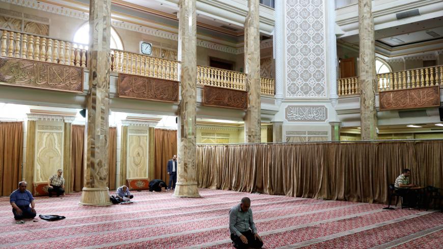 Iranian worshippers pray as they keep social distancing at a mosque following the outbreak of the coronavirus disease (COVID-19), in Tehran, Iran, April 30, 2020. WANA (West Asia News Agency)/Ali Khara via REUTERS ATTENTION EDITORS - THIS PICTURE WAS PROVIDED BY A THIRD PARTY - RC23FG9D1V51